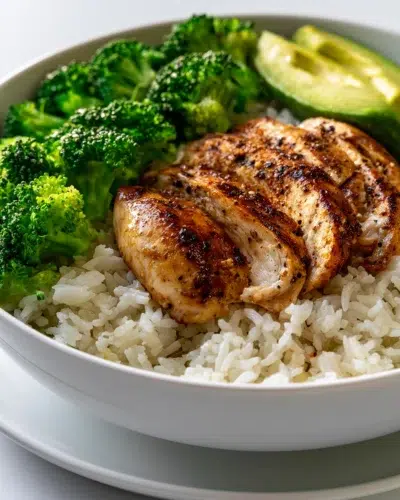 high protein chicken rice bowl with avocado broccoli recipe card